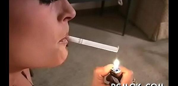  Elegant chick smokes a cig